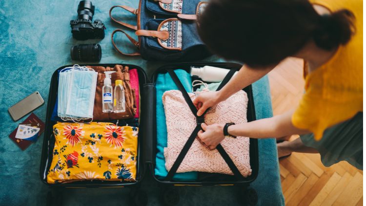 woman packing suitcase