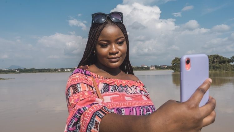 image, woman taking selfie, getting past the fear of first solo trip