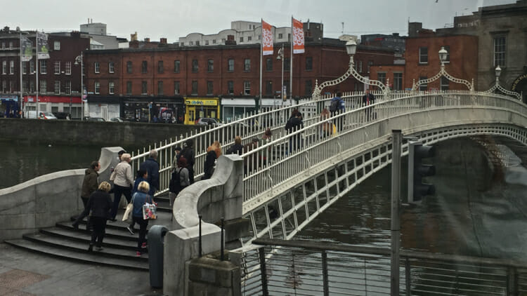 The Ha'penny bridge spans the River Liffey.