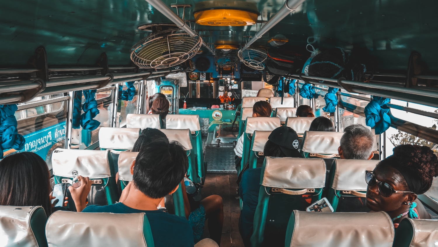 woman on a bus traveling to a music festival solo