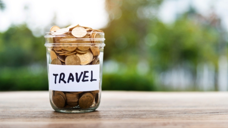 mason jar full of coins labelled "travel"