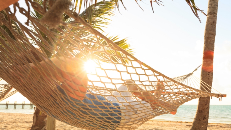 going to a resort alone can include solo time in a hammock by the beach