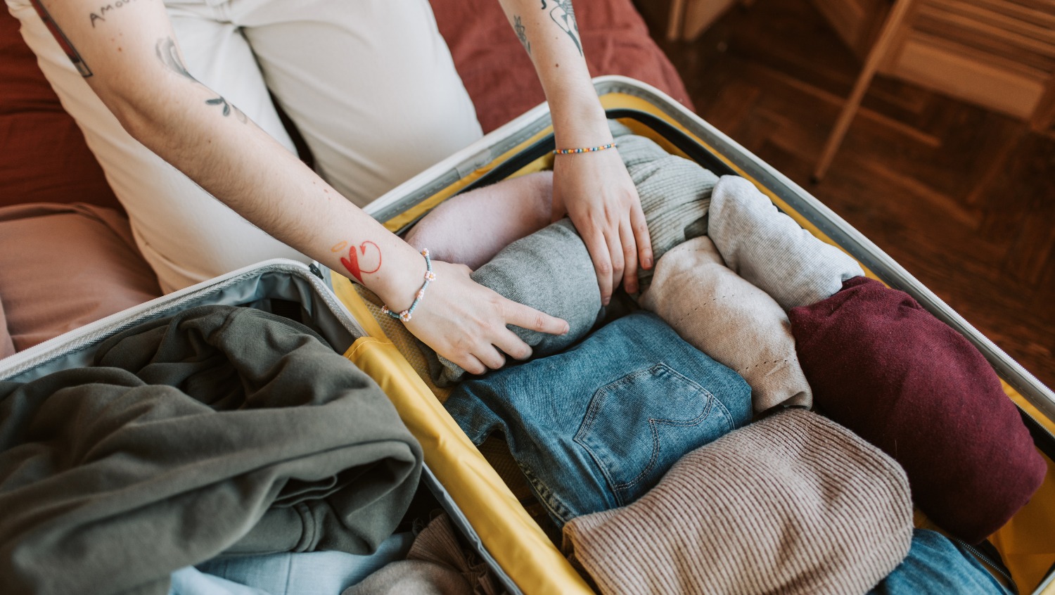 Image of traveler packing checked baggage.